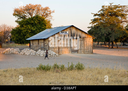 Village churche near Rundu in Namibia with boy walking by Stock Photo