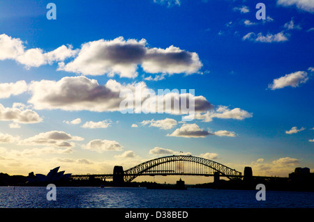 Sunset over the Sydney Harbor Bridge and the Opera House on Bennelong Point, Sydney New South Wales Australia Landscape [land] Stock Photo