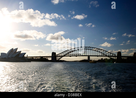 Sydney Australia skyline at dusk with the Sydney Harbor Bridge and Opera House in silhouette Stock Photo