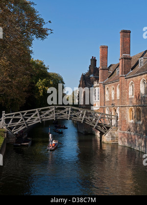 Punting on the River Cam, under the Mathematical Bridge, beside Queens' College, Cambridge, England Stock Photo