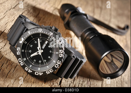 military watch and flashlight Stock Photo