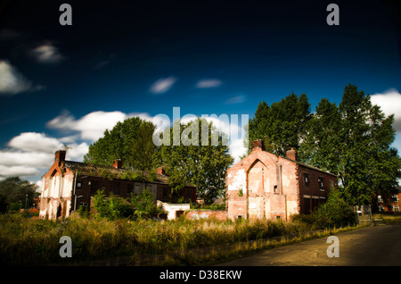 Urban decay, derelict houses, abandoned, renewal, trees blue sky, clouds, Stock Photo