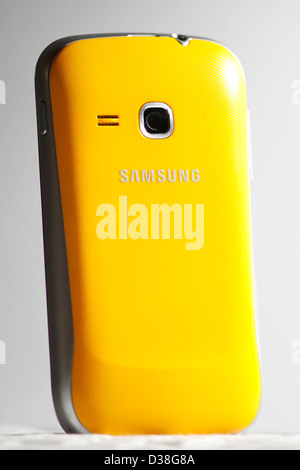 A yellow Samsung mobile phone. Stock Photo