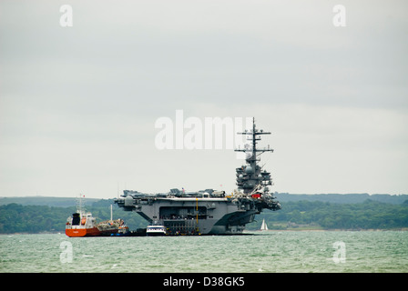 USS George HW Bush aircraft carrier anchored in the Solent off the Isle of Wight Stock Photo