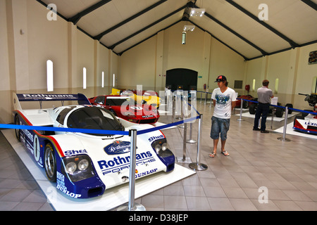 A visitor views a car at a collection of classic cars at the motor museum in Franschhoek Cape Town Stock Photo