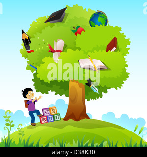 Schoolboy standing near a knowledge tree Stock Photo