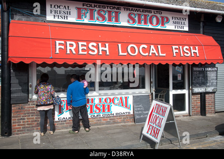 Fresh fish stall in Foilkestone harbour in Kent UK Stock Photo
