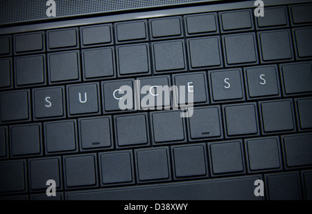 Success word on the keyboard. Stock Photo