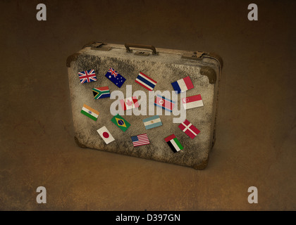 Conceptual image of national flags of different countries on suitcase representing global business travel Stock Photo