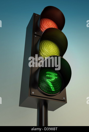 Low angle view of Indian Rupee on traffic light against clear sky Stock Photo