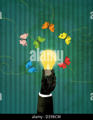 Human hand holding glowing light bulb with currency butterfly hovering around representing the concept of business attraction Stock Photo
