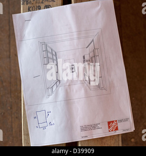 Plans for a new kitchen are part of a rehab of a foreclosed home. Stock Photo