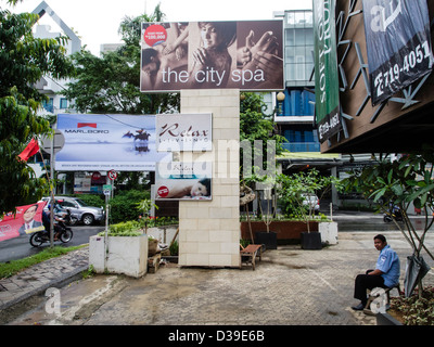 Kemang is a fast modernising neighbourhood in Jakarta with a lot of expatriates. Smoking advertisement still allowed. Stock Photo