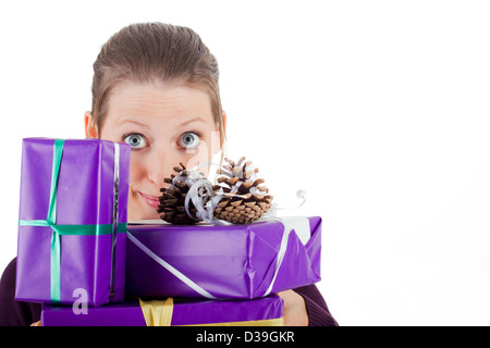 young pretty woman carry purple gifts and makes big eyes Stock Photo