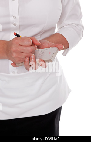 Waitress taking your order and writing it on her pad Stock Photo