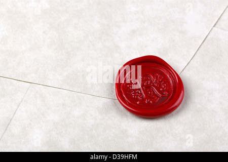 Envelope made from parchment paper sealed with a red wax seal Stock Photo