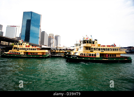 Two Sydney Ferries operated by the Harbour City Ferries company, at Circular Quay, Sydney Australia Stock Photo