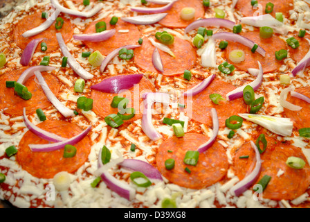 Raw Onion and Pepperoni Pizza Stock Photo