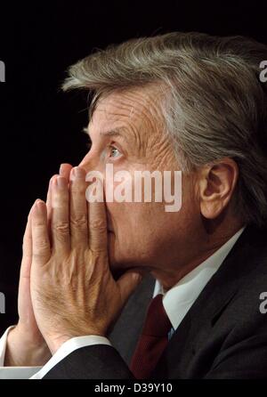 (dpa) -  Jean-Claude Trichet, the President of the European Central Bank (ECB), listens to a speech at the European Banking Congress 2003 in Frankfurt, 21 November 2003. German police found a suspect parcel which had been sent to Trichet. The parcel was delivered by the postal service but immediatel Stock Photo