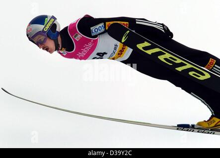 (dpa) - Polish ski jumper Adam Malysz flies through the air during a practice run before the official start of the 52nd International Four Hill Tournament in Oberstdorf, Germany, 28 December 2003. Stock Photo