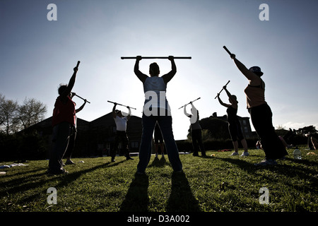 Fitness instructor leading weight lifting class at luxury boot camp, Kingston House, Totness, Devon Stock Photo