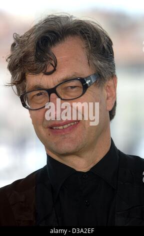 (dpa) - German film director Wim Wenders smiles during the 55th International Film Festival in Cannes, 22 May 2002. Stock Photo