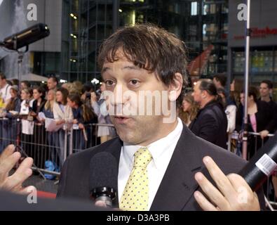 (dpa) - Director Sam Raimi answers journalist's questions as he arrives at the German premiere of his new film 'Spider-Man' in Berlin, 27 May 2002. 'Spider-Man', a record winning blockbuster in the US, will cast his net at the movies in Germany from 6 June 2002. Stock Photo