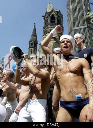 (dpa) - A group of young men dance in front of the Memorial Church during the Christopher Street Day Parade in Berlin, 22 June 2002. The traditional parade of gays and lesbians with 80 cars led from the Kurfuerstendamm to the Victory Column. Stock Photo