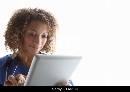 Doctor using tablet computer Stock Photo