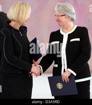 New Education Minister Johanna Wanka (L) shakes hands with outgoing minister Annette Schavan at Bellevue Palace in Berlin, Germany, 14 February 2013. German President Joachim Gauck presented the certificates of appointment and discharge earlier. Photo: WOLFGANG KUMM Stock Photo