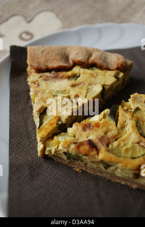 Two slices of vegetarian tart with zucchini, onion and tofu Stock Photo