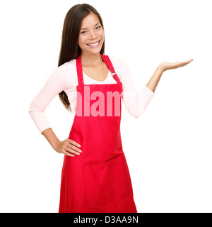 Portrait of mixed race young female small shop owner presenting copyspace with open hand palm isolated on white background Stock Photo