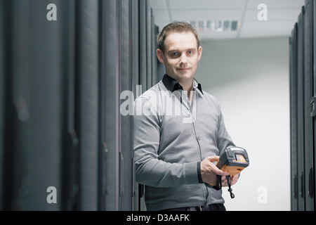 Man working in server room Stock Photo