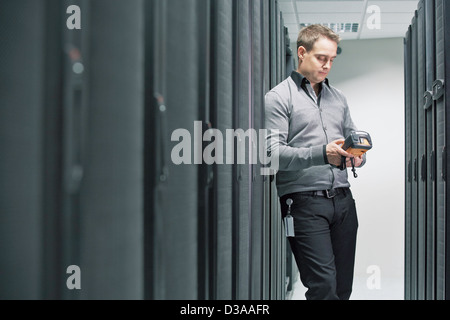 Man working in server room Stock Photo
