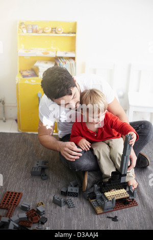 Father and son building with blocks Stock Photo