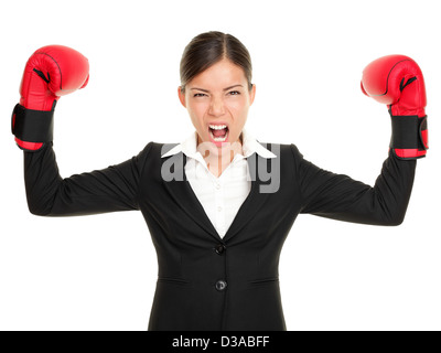 Aggressive multiracial young businesswoman flexing muscles wearing boxing gloves isolated on white background Stock Photo