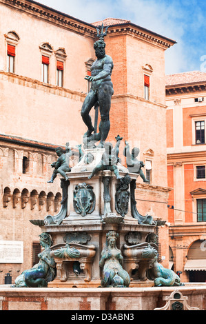 Fountain of Neptune on Piazza del Nettuno with Salaborsa on background in Bologna, Italy Stock Photo