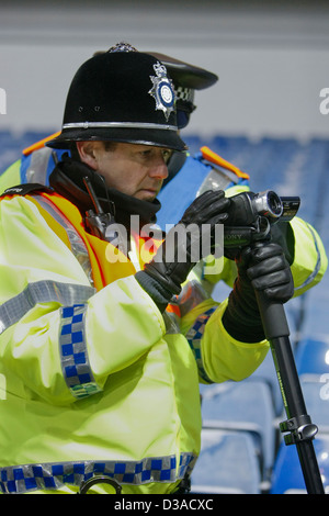 video surveillance by trained police officers at a UK football match ...
