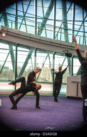 London, UK. 14th February 2013. Members of One Billlion Rising V Day flashmob celebrate the first flashmob inside London's City Hall. Credit:  Carole Edrich / Alamy Live News Stock Photo