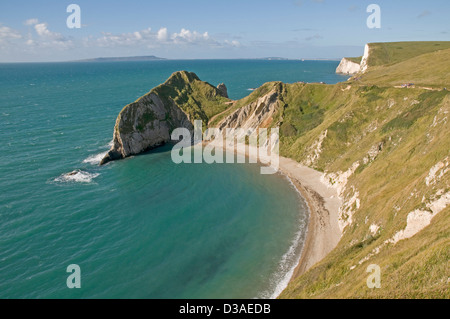 St Oswald's Bay on the Dorset coast, with Swyre Head and Bat's Head further along the coast , and the distant Isle of Portland. Stock Photo