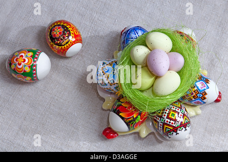Painted Colorful Easter Eggs on linen fabric Stock Photo