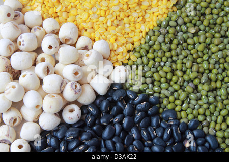 Heap of four grains including mung soybean dried lotus seeds and black peas. Stock Photo