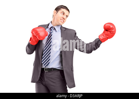 Young businessman posing with red boxing gloves isolated on white background Stock Photo