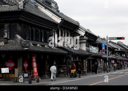 February 14, 2013, Kawagoe, Japan - Tourist visit the stores along the main street of Little Edo, Kawagoe. An old town from Edo Period (1603-1867) is located in Kawagoe, 30 minutes by train from central Tokyo. In the past Kawagoe was an important city for trade and strategic purpose, the shogun installed some of their most important loyal men as lords of Kawagoe Castle. Every year 'Kawagoe Festival' is held in the third weekend of October, people pull portable shrine during the parade, later 'dashi' floats on the streets nearby. The festival started 360 years ago supported by Nobutsuna Matsuda Stock Photo