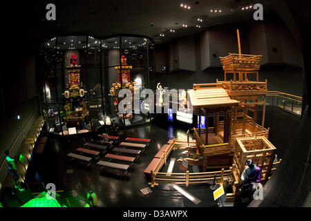 February 14, 2013, Kawagoe, Japan - The Kawagoe Festival Museum exhibits two kinds of dashi (portable shrine). An old town from Edo Period (1603-1867) is located in Kawagoe, 30 minutes by train from central Tokyo. In the past Kawagoe was an important city for trade and strategic purpose, the shogun installed some of their most important loyal men as lords of Kawagoe Castle. Every year 'Kawagoe Festival' is held in the third weekend of October, people pull portable shrine during the parade, later 'dashi' floats on the streets nearby. The festival started 360 years ago supported by Nobutsuna Mat Stock Photo