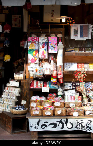 February 14, 2013, Kawagoe, Japan - Traditional Japanese sweets and toys  at 'Little Edo', Kawagoe. An old town from Edo Period (1603-1867) is located in Kawagoe, 30 minutes by train from central Tokyo. In the past Kawagoe was an important city for trade and strategic purpose, the shogun installed some of their most important loyal men as lords of Kawagoe Castle. Every year 'Kawagoe Festival' is held in the third weekend of October, people pull portable shrine during the parade, later 'dashi' floats on the streets nearby. The festival started 360 years ago supported by Nobutsuna Matsudaira, lo Stock Photo