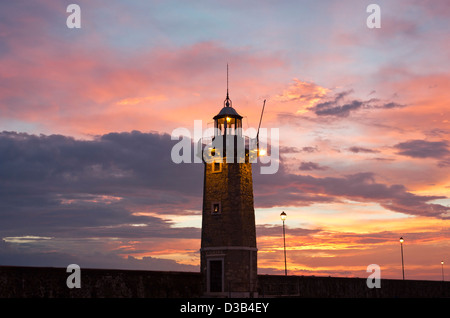 Desenzano Del Garda the old Lighthouse close up shot in an early morning beautiful sunrise. Stock Photo