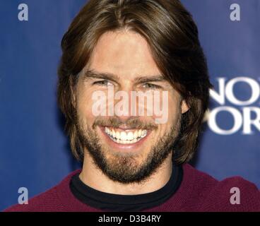 (dpa) - US actor Tom Cruise smiles during a press conference in Berlin, 26 September 2002. He came to Berlin to present his new movie, 'Minority Report', which premieres in Berlin. In the film Cruise plays a cop in the future working in a division of the police department that arrests killers before Stock Photo