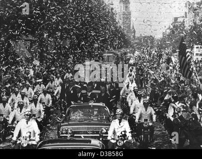 (dpa files) - US President John F. Kennedy (L) is celebrated with a confetti rain as he is escorted in an open limousine through the Rheinstrasse in West Berlin, 26 June 1963. The president is accompanied in the car by Berlin Mayor Willy Brandt (C) and German Chancellor Konrad Adenauer (R). The clim Stock Photo