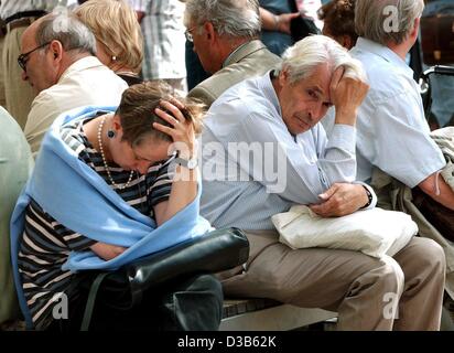 (dpa) - Attendants of a memorial service for the victims of the 11 September terror attacks are deeply moved, Berlin, 11 September 2002. The service in the Cathedral in Berlin was transmitted on screens outside. On the first anniversary of the attacks the victims were commemorated all over the world Stock Photo